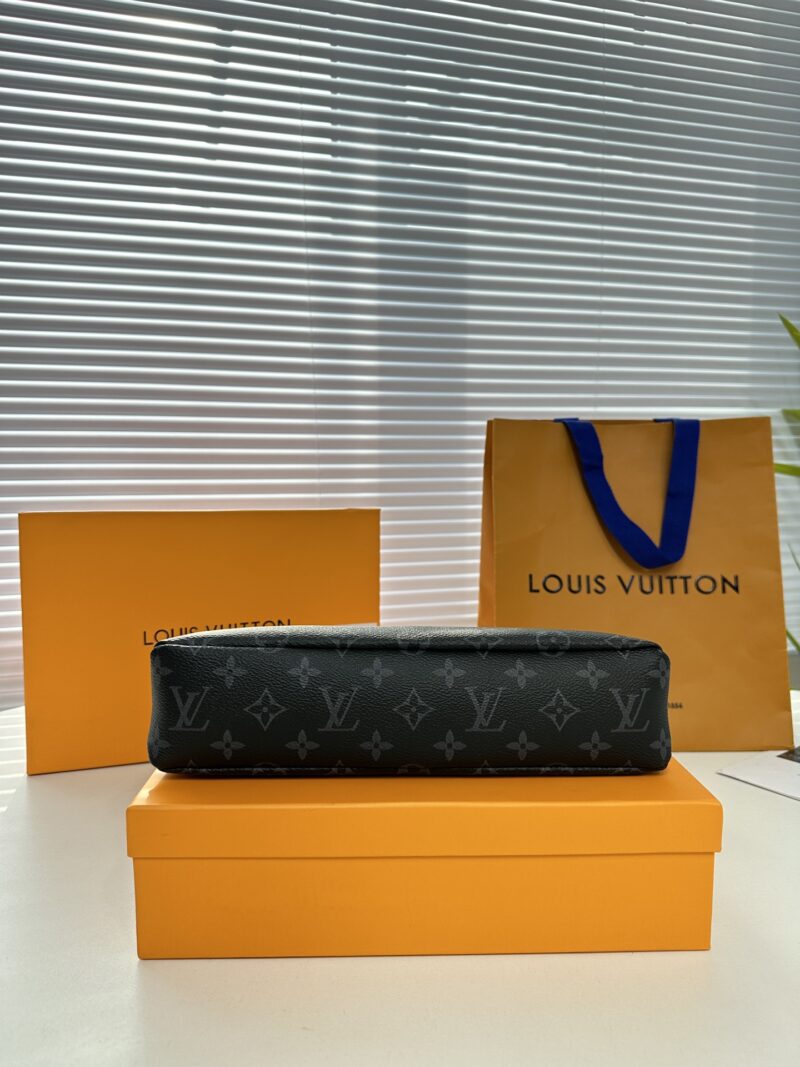 Exclusive real-life shot of M82543 black floral Pochette Voyage Souple handbag with gift box. Made of soft Monogram Eclipse coated canvas, the classic Pochette Voyage handbag lines are outlined with rounded strokes, providing a comfortable and portab...