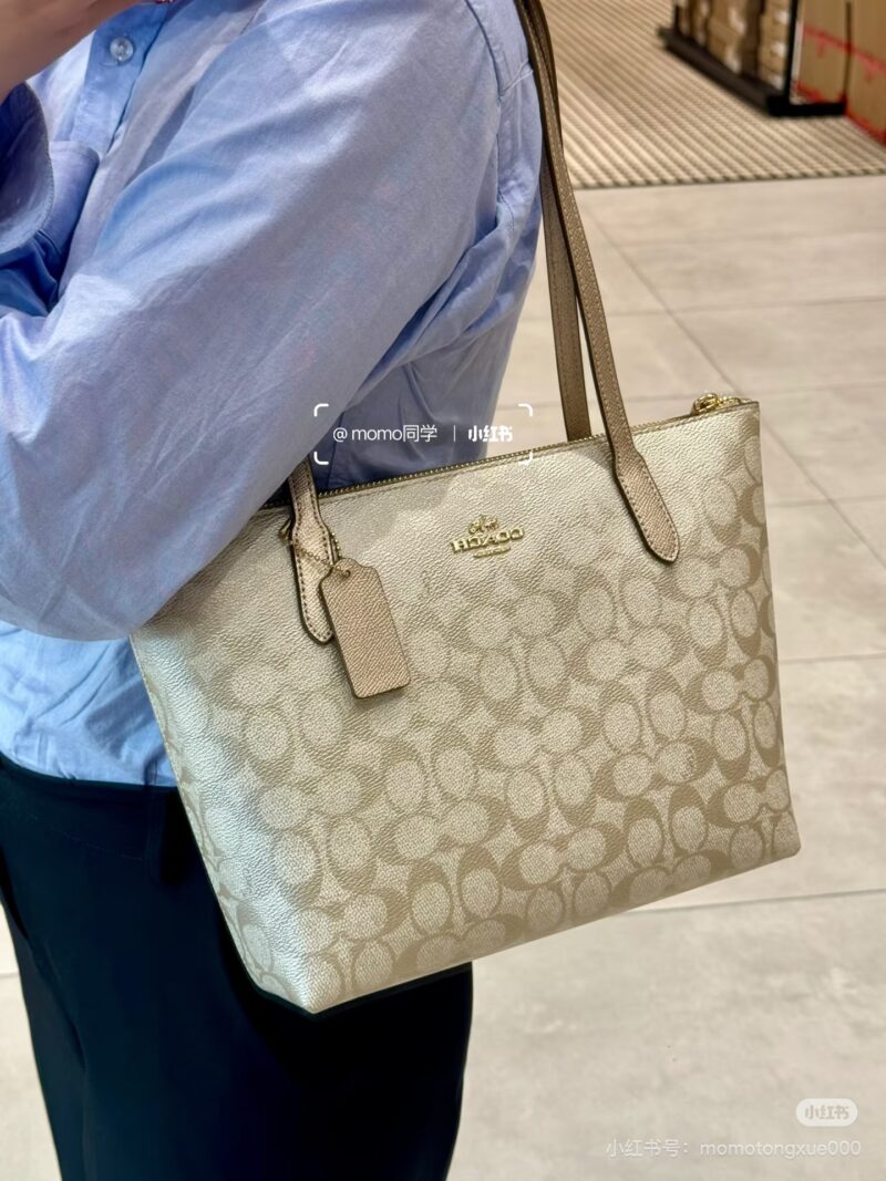 Coach pearl colored shopping bag