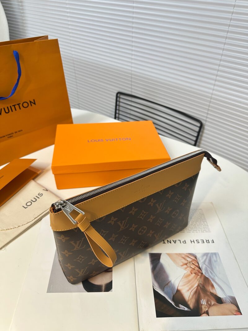 3b08e47ba3.jpg Exclusive real-life shot of M14057 vintage Pochette Voyage Souple handbag with gift box. Made of soft Monogram Eclipse coated canvas, the classic Pochette Voyage handbag lines are outlined with rounded strokes, providing a comfortable and portable ex...