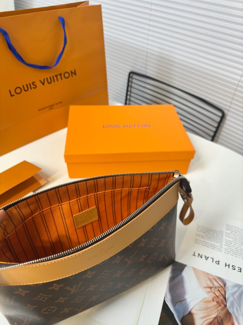 a490248cc2.jpg Exclusive real-life shot of M14057 vintage Pochette Voyage Souple handbag with gift box. Made of soft Monogram Eclipse coated canvas, the classic Pochette Voyage handbag lines are outlined with rounded strokes, providing a comfortable and portable ex...