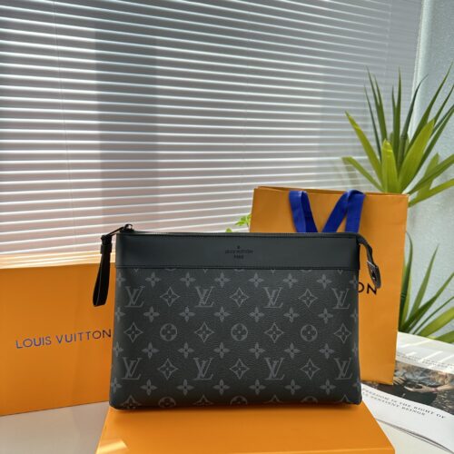 Exclusive real-life shot of M82543 black floral Pochette Voyage Souple handbag with gift box. Made of soft Monogram Eclipse coated canvas, the classic Pochette Voyage handbag lines are outlined with rounded strokes, providing a comfortable and portab...