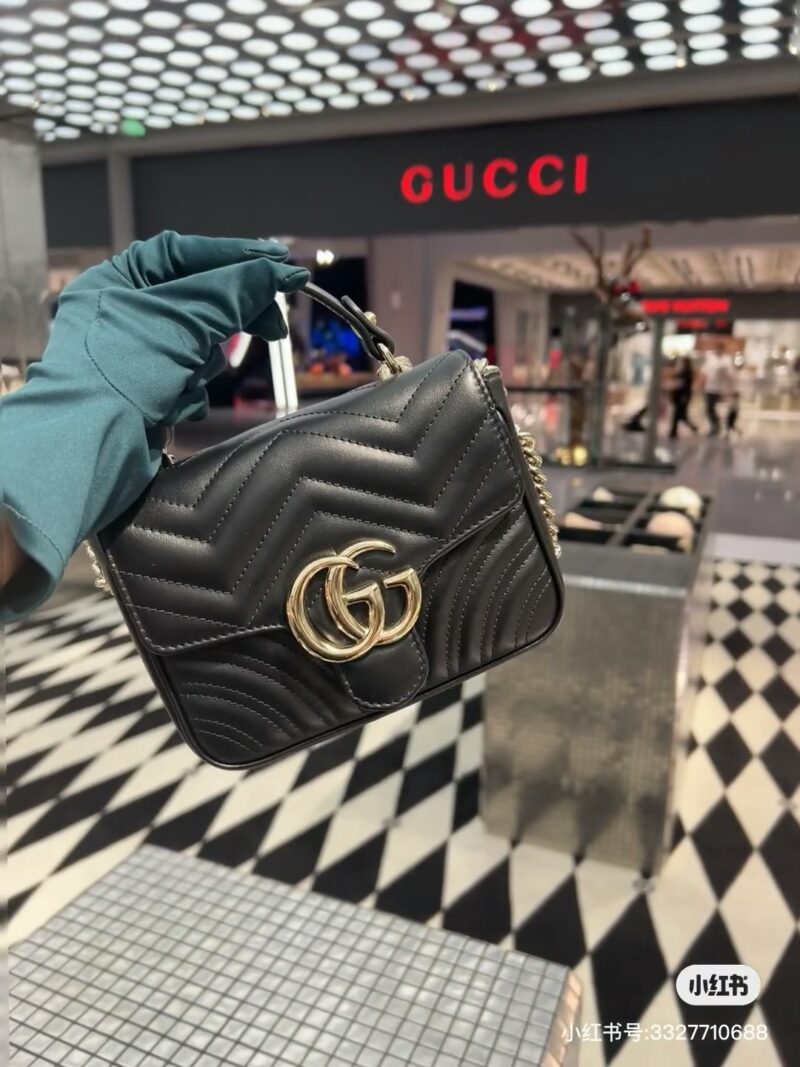Gucci handheld chubby guy