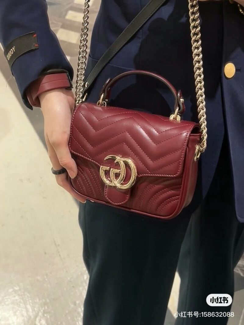 Gucci handheld chubby guy